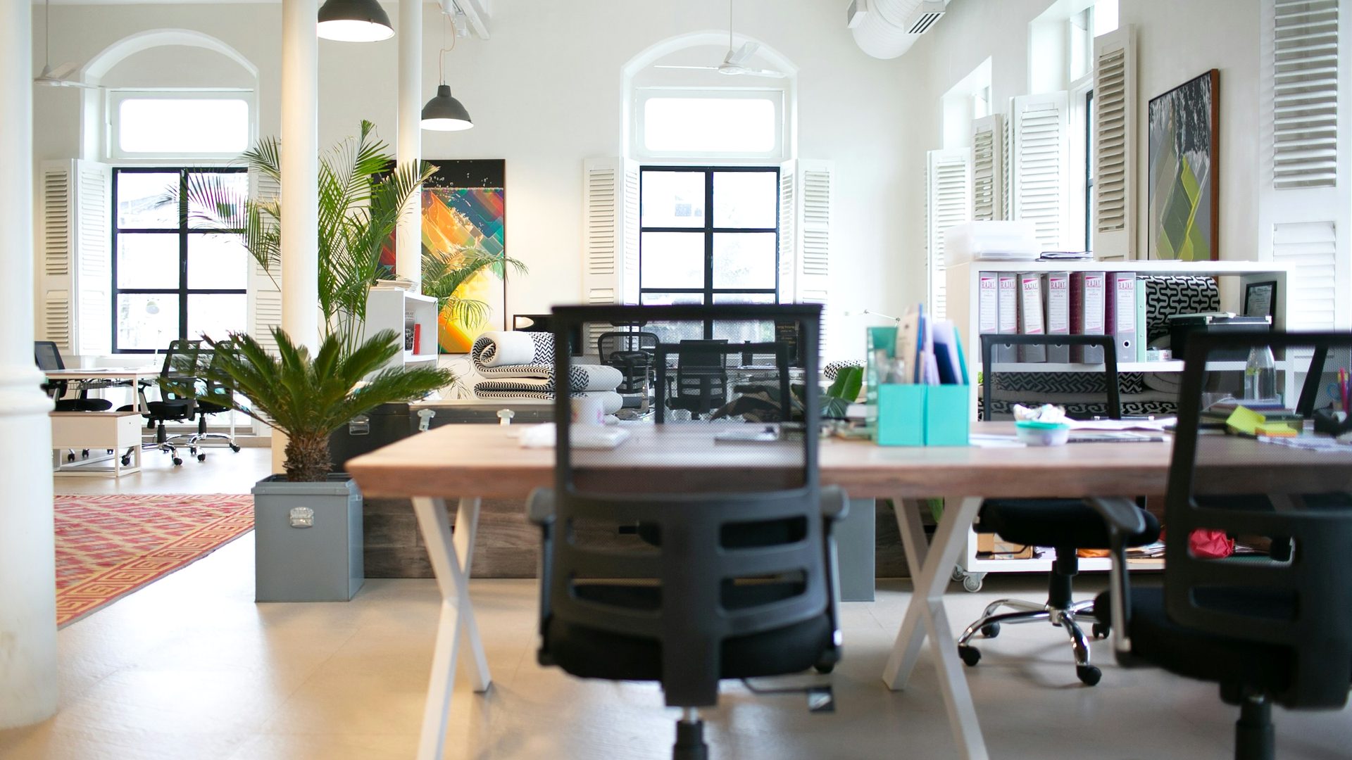 Open plan office with assembled desks and chairs ready for the team