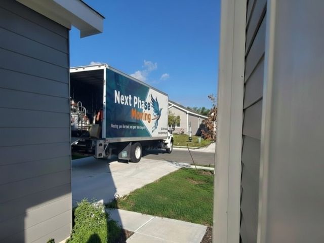 Next Phase truck arriving at a customer's home